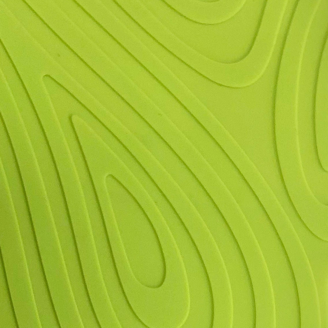 Close-up of atomic green keeps glove textured surface with wavy lines